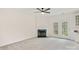 Cozy living room with a fireplace, plush carpet, and a door leading to the outside at 16631 Commons Creek Dr, Charlotte, NC 28277