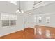 Bright living room with hardwood floors, lots of light, and a view to the staircase at 16631 Commons Creek Dr, Charlotte, NC 28277