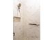 Bathroom shower with marble tile, a handheld shower head and a built-in niche for added storage at 16631 Commons Creek Dr, Charlotte, NC 28277