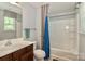 Bright bathroom with a shower-tub combination and a wood vanity with a white countertop at 168 Limerick Rd # C, Mooresville, NC 28115