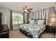Bedroom with a gray accent wall, ceiling fan, and a window letting in natural light at 168 Limerick Rd # C, Mooresville, NC 28115