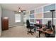 Bedroom featuring neutral carpet, a ceiling fan, and a gray accent wall with white squares at 168 Limerick Rd # C, Mooresville, NC 28115