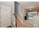 Welcoming entryway featuring a carpeted staircase and access to the adjacent living area at 168 Limerick Rd # C, Mooresville, NC 28115