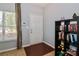 Inviting entryway with wood floors, neutral walls, and a convenient shelving unit at 168 Limerick Rd # C, Mooresville, NC 28115