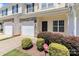 Well-kept townhouse with stone details, an attached garage, and a landscaped yard at 168 Limerick Rd # C, Mooresville, NC 28115