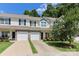Inviting townhouse with stone accents, attached garage, and well-maintained front yard at 168 Limerick Rd # C, Mooresville, NC 28115