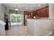 Bright eat-in kitchen boasts stainless steel appliances, granite countertops, and glass patio doors at 168 Limerick Rd # C, Mooresville, NC 28115