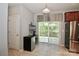 Bright kitchenette features a bar fridge and glass patio doors providing lots of light at 168 Limerick Rd # C, Mooresville, NC 28115