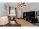 Comfortable living room featuring neutral walls, plush carpet, and a ceiling fan at 168 Limerick Rd # C, Mooresville, NC 28115