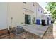 Back patio featuring an AC unit, sliding glass door, and trash cans, perfect for outdoor relaxation at 168 Limerick Rd # C, Mooresville, NC 28115