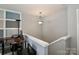 Upstairs area featuring neutral carpet, a ceiling fan, and a gray accent wall with white squares at 168 Limerick Rd # C, Mooresville, NC 28115