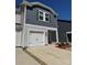Charming home featuring gray and white siding, a single-car garage, and a welcoming entryway at 1843 Old Rivers Rd # 209, Concord, NC 28027