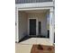 Inviting front entrance featuring a covered porch, decorative welcome sign and house numbers on the support at 1843 Old Rivers Rd # 209, Concord, NC 28027