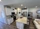 Well-appointed kitchen featuring an island, stainless steel appliances, and white cabinetry at 1843 Old Rivers Rd # 209, Concord, NC 28027