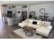 Bright living room features a comfortable sectional sofa, wooden floors, and stylish furnishings at 1843 Old Rivers Rd # 209, Concord, NC 28027