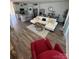 Spacious living room with a large sectional, wood flooring, and neutral decor at 1843 Old Rivers Rd # 209, Concord, NC 28027