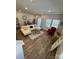 Inviting living room with natural light, wood floors, comfortable seating, and tasteful decor at 1843 Old Rivers Rd # 209, Concord, NC 28027
