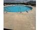 Large community pool with ample seating, perfect for relaxing and enjoying the outdoors at 1843 Old Rivers Rd # 209, Concord, NC 28027