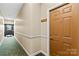Hallway view with apartment door and exterior access at 19725 Deer Valley Dr, Cornelius, NC 28031