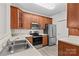 This kitchen features stainless steel appliances, wood cabinets, and light countertops at 19725 Deer Valley Dr, Cornelius, NC 28031