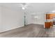 Bright, open living space with modern flooring flowing to the kitchen with wood cabinets at 19725 Deer Valley Dr, Cornelius, NC 28031