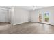 Spacious living room with a door to the outside and modern flooring at 19725 Deer Valley Dr, Cornelius, NC 28031