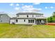 Expansive backyard featuring a fire pit and a screened-in porch for outdoor enjoyment at 2009 Autumn Dr # 2, Monroe, NC 28110