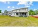 Lush backyard with covered porch and fire pit area, ideal for relaxation and gatherings at 2009 Autumn Dr # 2, Monroe, NC 28110