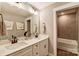 Bathroom featuring a dual sink vanity, modern fixtures, and tiled shower at 2009 Autumn Dr # 2, Monroe, NC 28110