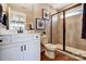 Bathroom featuring a glass shower, framed art, and white shaker vanity with black hardware at 2009 Autumn Dr # 2, Monroe, NC 28110