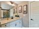 Modern bathroom featuring a sleek vanity, large mirror, and stylish wall art at 2009 Autumn Dr # 2, Monroe, NC 28110