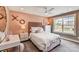 Stylishly decorated bedroom with large window and XOX wall decor at 2009 Autumn Dr # 2, Monroe, NC 28110