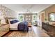 Beautifully decorated bedroom featuring a plush bed, stylish wallpaper, and hardwood floors at 2009 Autumn Dr # 2, Monroe, NC 28110