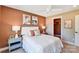 Comfortable bedroom with plush bedding, decorative lamps, and easy closet access at 2009 Autumn Dr # 2, Monroe, NC 28110
