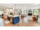 Open-concept kitchen and living room with hardwood floors and fireplace at 2009 Autumn Dr # 2, Monroe, NC 28110