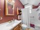 Cozy bathroom with a tub and shower, vanity, and decorative accents at 208 Park Ave, Wadesboro, NC 28170