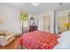 Bedroom with hardwood floors, chair, dresser, and natural light at 208 Park Ave, Wadesboro, NC 28170