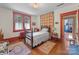 Comfortable bedroom with hardwood floors, radiator, and classic decor at 208 Park Ave, Wadesboro, NC 28170