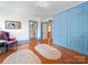 Bedroom featuring built-in storage, a classic purple armchair and light-filled hallway at 208 Park Ave, Wadesboro, NC 28170