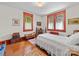 Charming bedroom featuring wood floors, and ample natural light at 208 Park Ave, Wadesboro, NC 28170