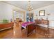 Charming dining room with hardwood floors, elegant chandelier, and vintage furniture at 208 Park Ave, Wadesboro, NC 28170