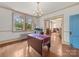 Elegant dining room featuring hardwood floors, an ornate chandelier and vintage decor at 208 Park Ave, Wadesboro, NC 28170