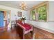 Bright dining room featuring hardwood floors, a chandelier, and natural light at 208 Park Ave, Wadesboro, NC 28170