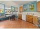 Eat-in kitchen showcasing tile floors, wood cabinets and a breakfast nook at 208 Park Ave, Wadesboro, NC 28170