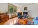 Comfortable living room features a fireplace, wood floors, and vintage-inspired decor at 208 Park Ave, Wadesboro, NC 28170