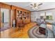 Inviting living room with hardwood floors, built-in bookshelf, and ample natural light at 208 Park Ave, Wadesboro, NC 28170