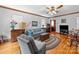 Cozy living room with wood trim, ceiling fan, and classic furnishings at 208 Park Ave, Wadesboro, NC 28170