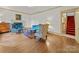 Warm living room with a fireplace, hardwood floors, and staircase access at 208 Park Ave, Wadesboro, NC 28170