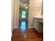 Hallway view of bathroom with granite countertops, vanity and updated fixtures at 211 Worthington St, Shelby, NC 28150