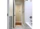 Bathroom featuring a shower/tub combination and an open doorway to the hallway at 211 Worthington St, Shelby, NC 28150